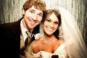 Young newly wed couple with great smile from cosmetic dentistry services.